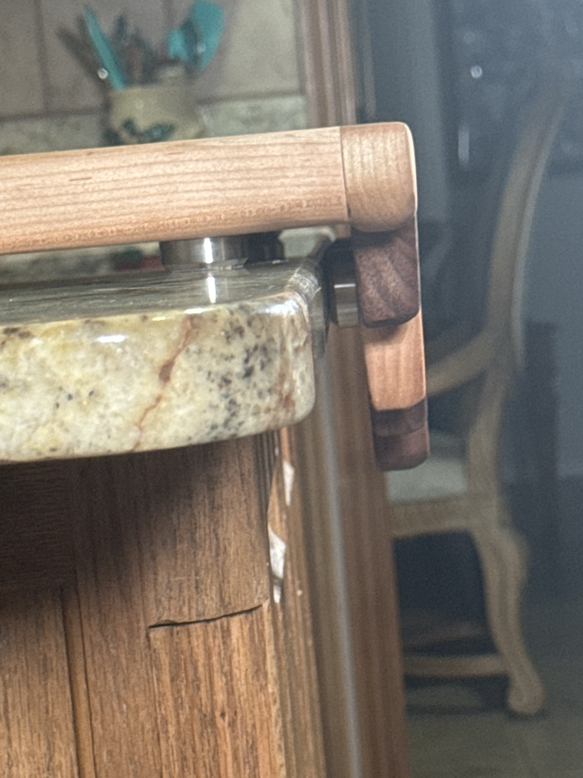 Angled view of the Melted Edge Cutting Board showing the juice groove and hardwood striping